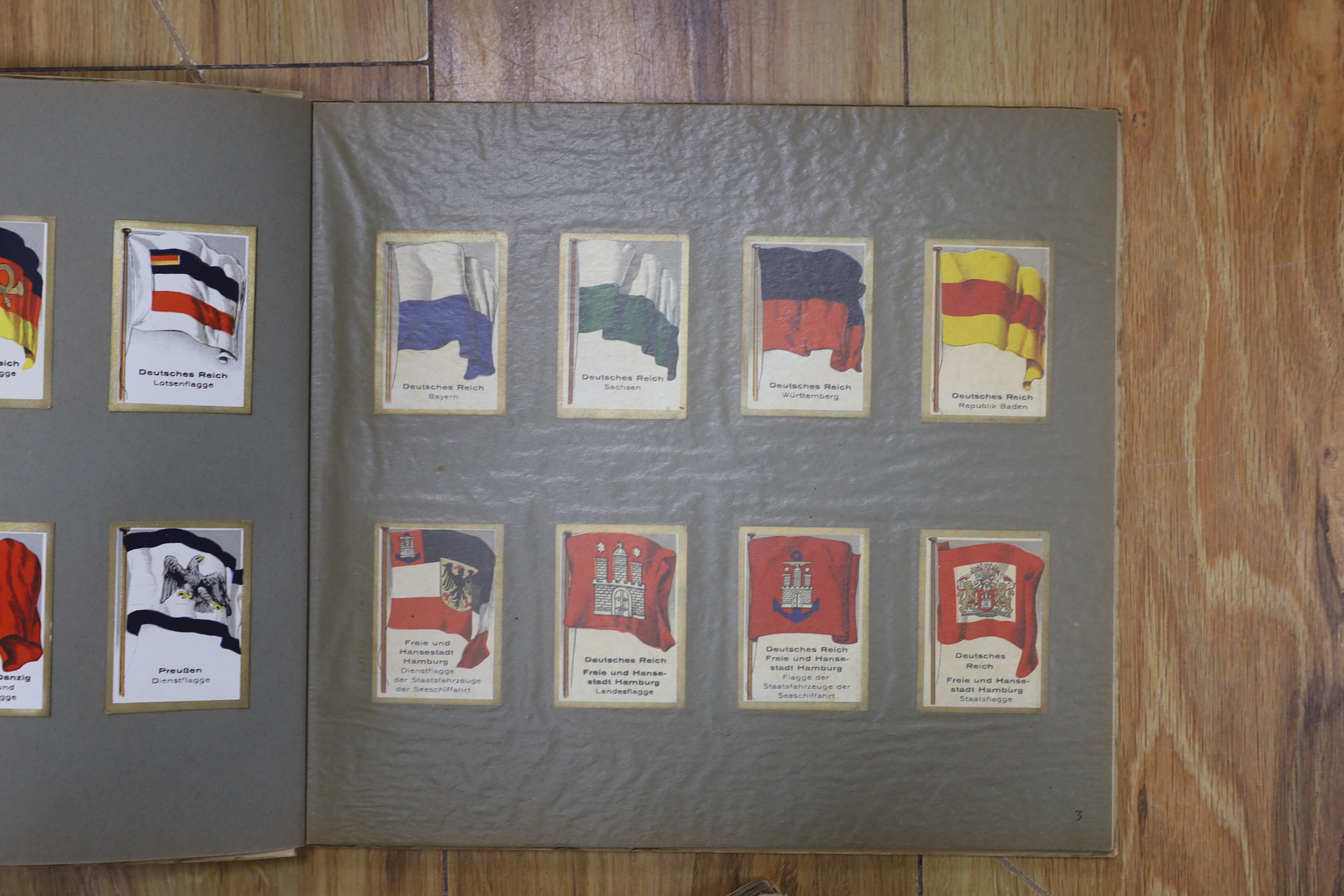 A collection of cigarette cards in albums